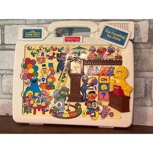 Vintage Fisher-Price Talk'n Teach Tag Along Sesame Street The Counting Toy Store